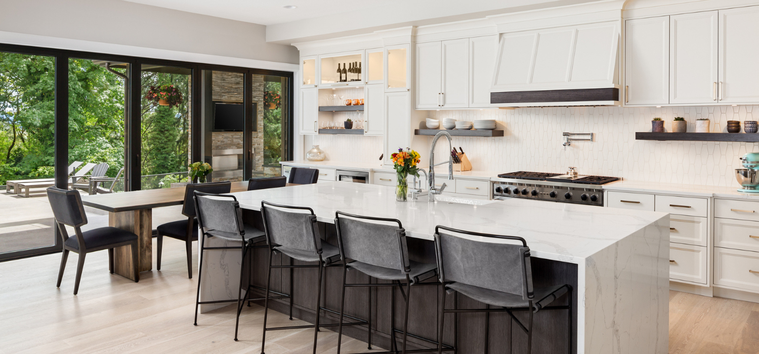 Open-concept kitchen with spotless island after thorough home cleaning service.